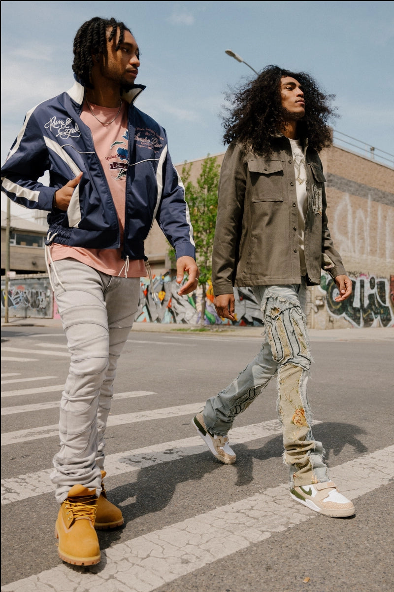 Two models wearing the latest Fall '24 Collection walking on the streets of New York City