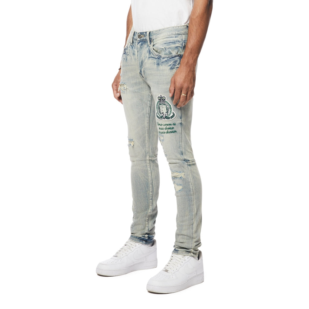 Smoke Rise Preppy Crest Embroidered Slim Tapered Denim Jeans - Cascade Blue